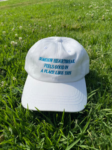 Somehow Heartbreak Feels Good In A Place Like This Hat