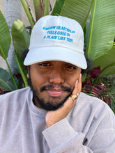 Load image into Gallery viewer, Somehow Heartbreak Feels Good In A Place Like This Hat